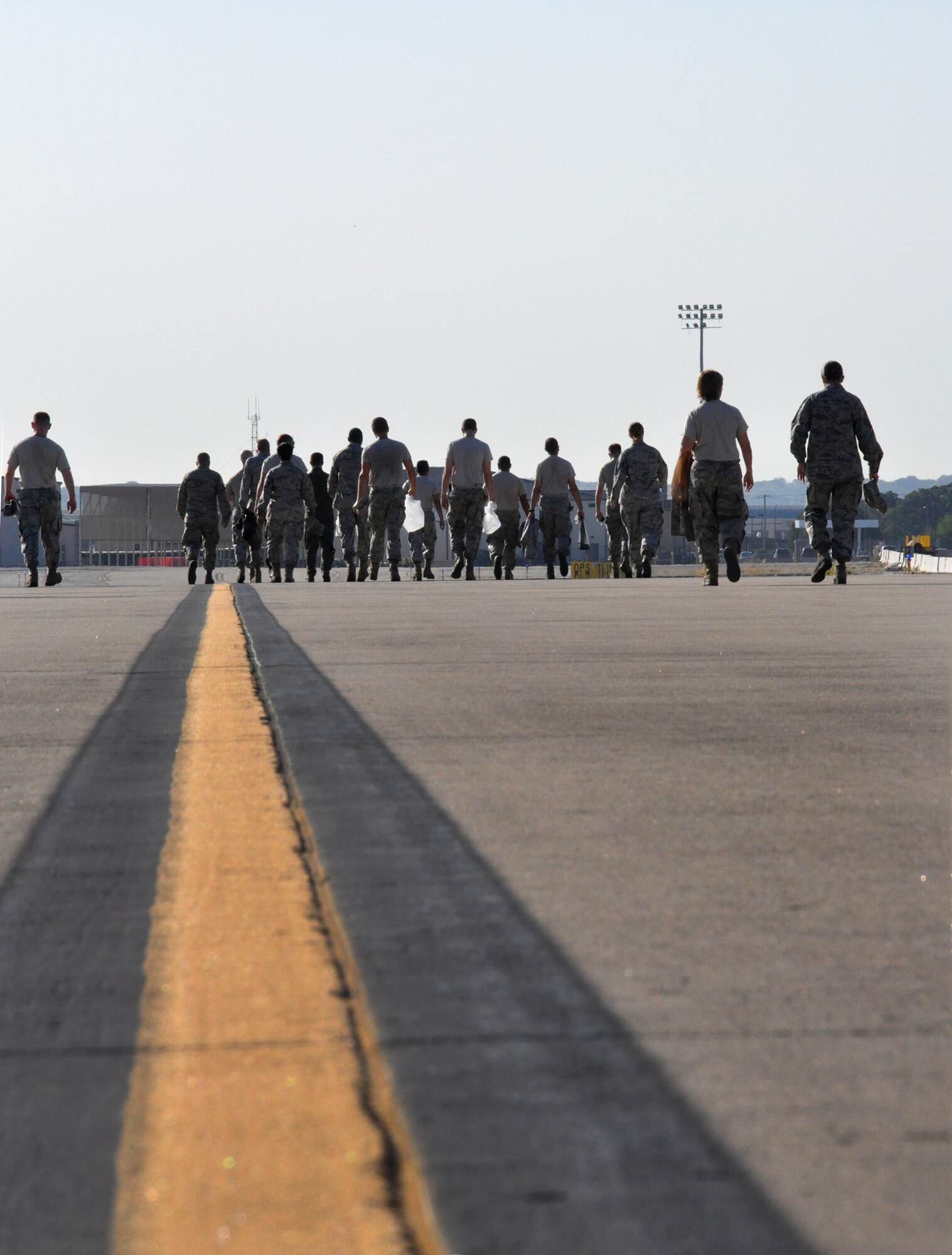 Air Reserve and Air National Guardsmen join in the Naval Air Station Fort Worth Joint Reserve Base Foreign Object Debris (FOD) walk August 29 prior to aircraft returning to the base. FOD creates safety hazards and can ultimately impact safe operations by damaging aircraft. All NAS JRB aircraft were based out of Alliance Airport while the runway received a makeover for the first time in about ten years. Aircraft and support personnel are schedule to return by the end of August. (U.S. Air Force photo/Master Sgt. Julie Briden-Garcia)
