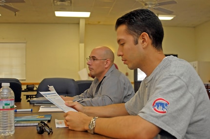 Master Sgt. Anthony Witak, 902nd Force Support Squadron customer support superintendent (back), and Tech. Sgt. Erik Herrera, Air Education and Training Command chaplain assistant (front), attend a Boots to Business entrepreneur track Aug. 20 at the Joint Base San Antonio-Randolph Airman Family Readiness Center. Boots to Business is a three-step training program developed to introduce and train transitioning service members for business ownership. (U.S. Air Force photo by Airman 1st Class Kenna Jackson)