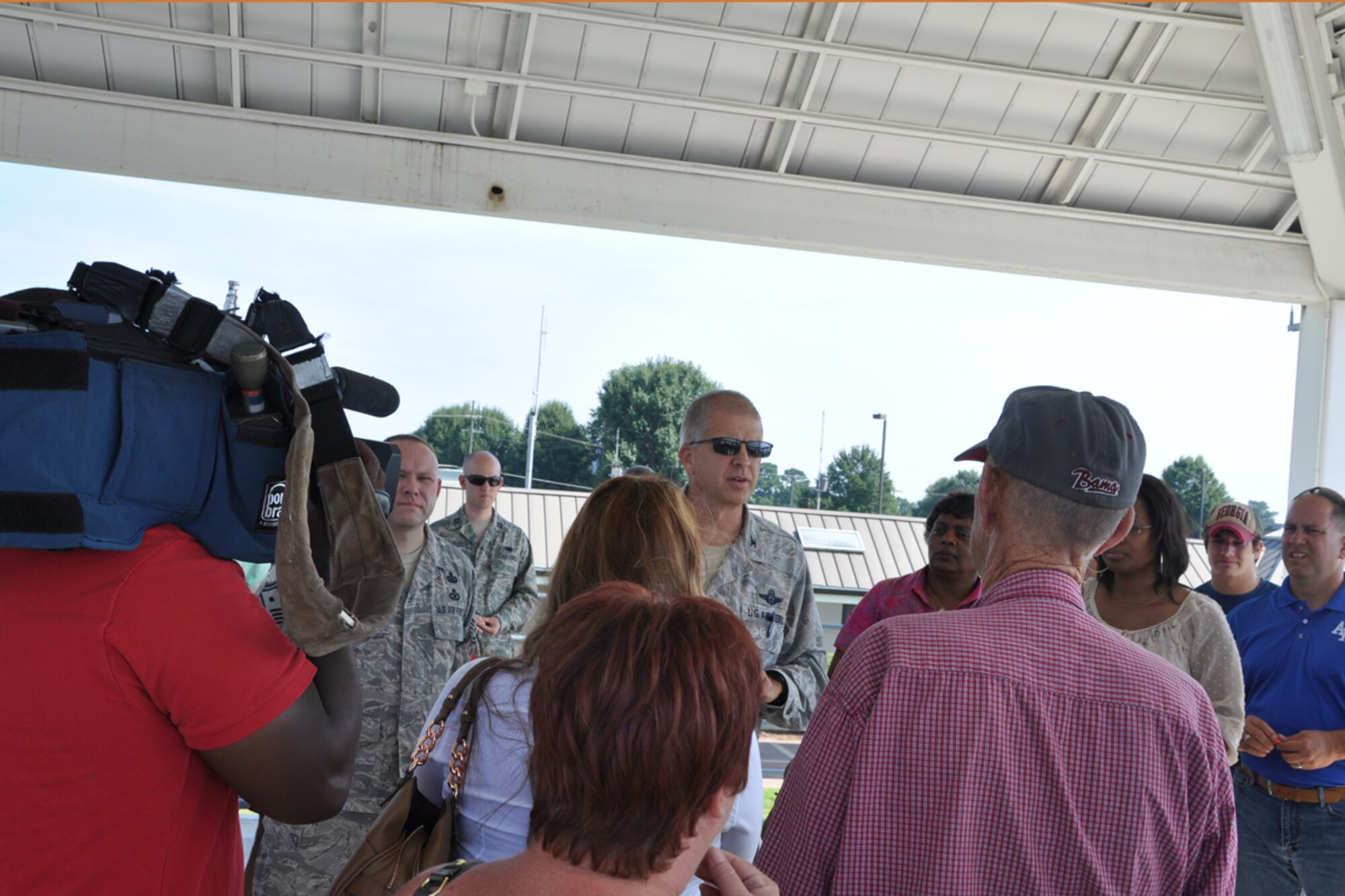 Col. Tim Tarchick, 94th Airlift Wing commander, thanks families and friends of 80th Aerial Port Squadron members, moments before the welcome home celebration Aug. 27. Over 20 members of the squadron returned from a six-month deployment to Southwest Asia. (U.S. Air Force photo/James Branch)