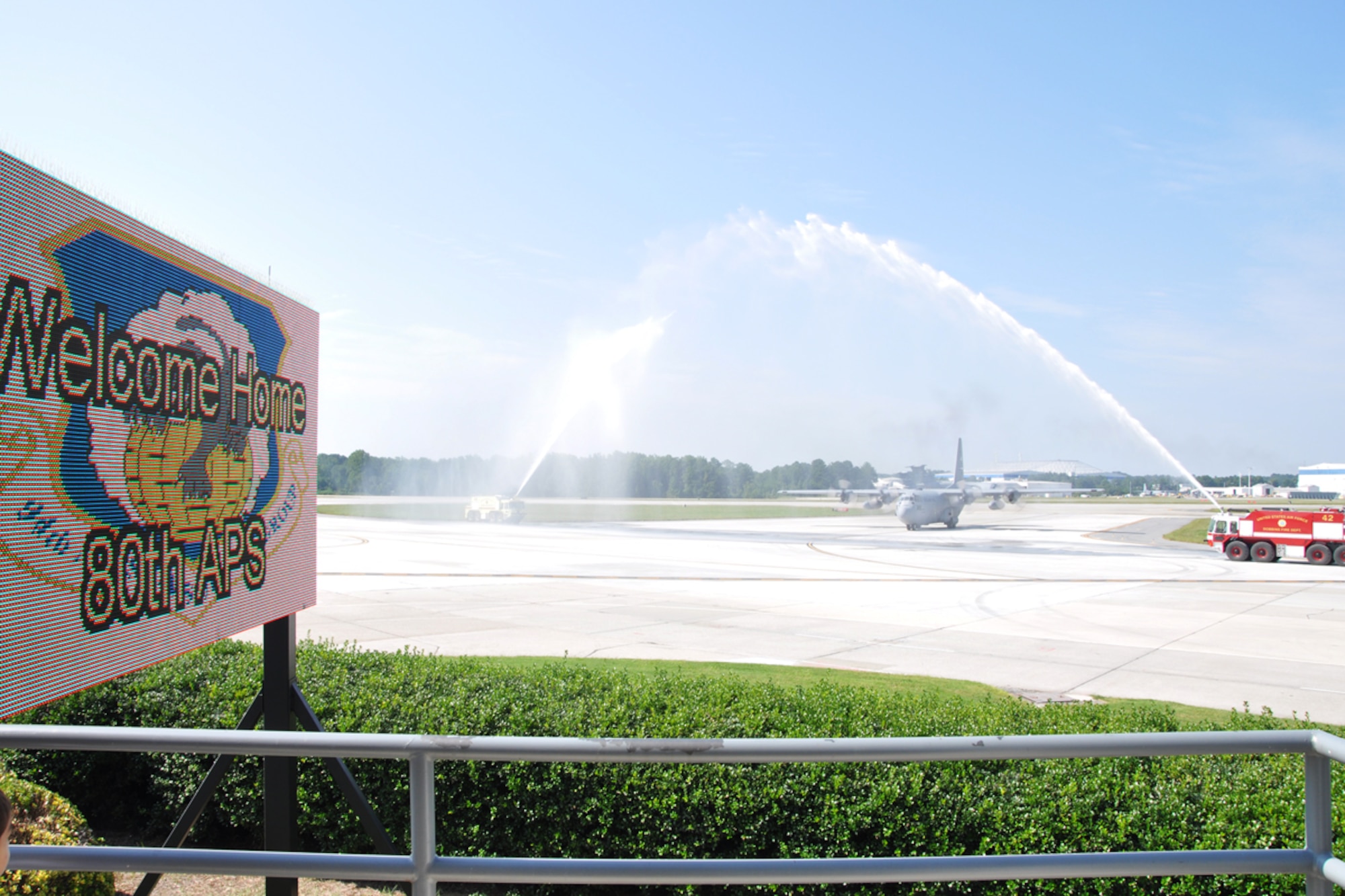 Members of the 80th Aerial Port Squadron return to Dobbins Air Reserve Base from a six-month deployment to Southwest Asia Aug. 27. The crew moved 20,000 tons of cargo and 38,000 passengers over 1,500 sorties and provided mobility training to civilians and military members of the host countries. (U.S. Air Force photo/James Branch)