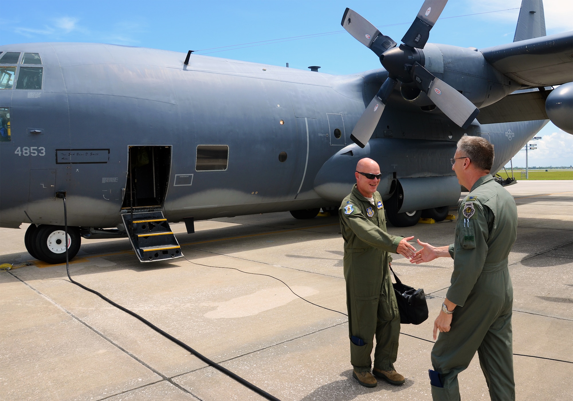 The 920th Rescue Wing received a search-and-rescue aircraft from the 71st Rescue Squadron at Moody AFB, Ga. today. The HC-130P King refueler replaced a WC-130J model used mostly for training due to its lack of refueling capability. 920th Rescue Wing commander Col. Jeffrey Macrander is seen here congratulating Lt. Jeffrey Hannold, 920th Operations Group Standardization and Evaluation, on a safe delivery of the new aircraft. (U.S. Air Force photo/Master Sgt. Paul Flipse)