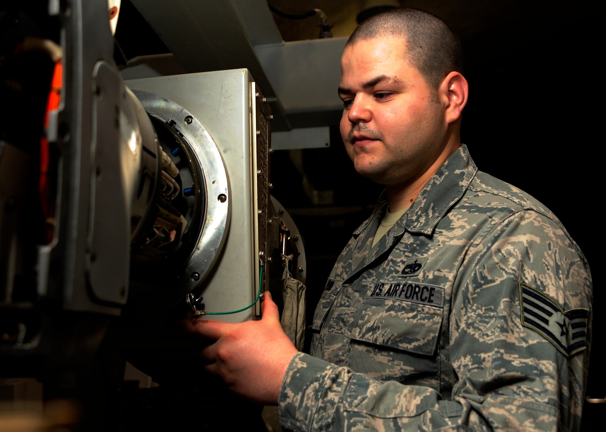 Staff Sgt. Isaiah Puma installs an antenna shield on an electronic countermeasure pod, which protects the individual from radio frequencies and takes readings at the 379th Air Expeditionary Wing in Southwest Asia, Aug. 26, 2013. Puma is a 379th Expeditionary Maintenance Squadron ECM team leader deployed from Spangdahlem Air Base, Germany, and a Denver, Colo., native. (U.S. Air Force photo/Senior Airman Bahja J. Jones) 