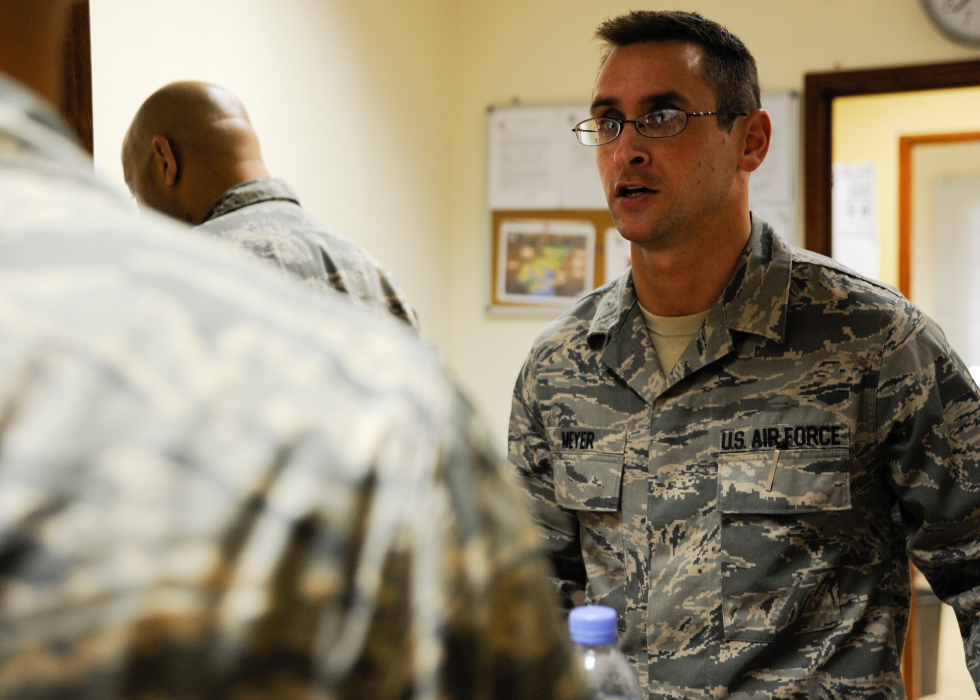 Tech. Sgt. Michael Meyer assists a customer with a financial inquiry at the 379th Air Expeditionary Wing in Southwest Asia, Aug. 26, 2013. Meyer is a 379th Expeditionary Comptroller Squadron customer service technician deployed from Grissom Air Reserve Base, Ind., and a Fort Wayne, Ind., native. (U.S. Air Force photo/Senior Airman Bahja J. Jones) 