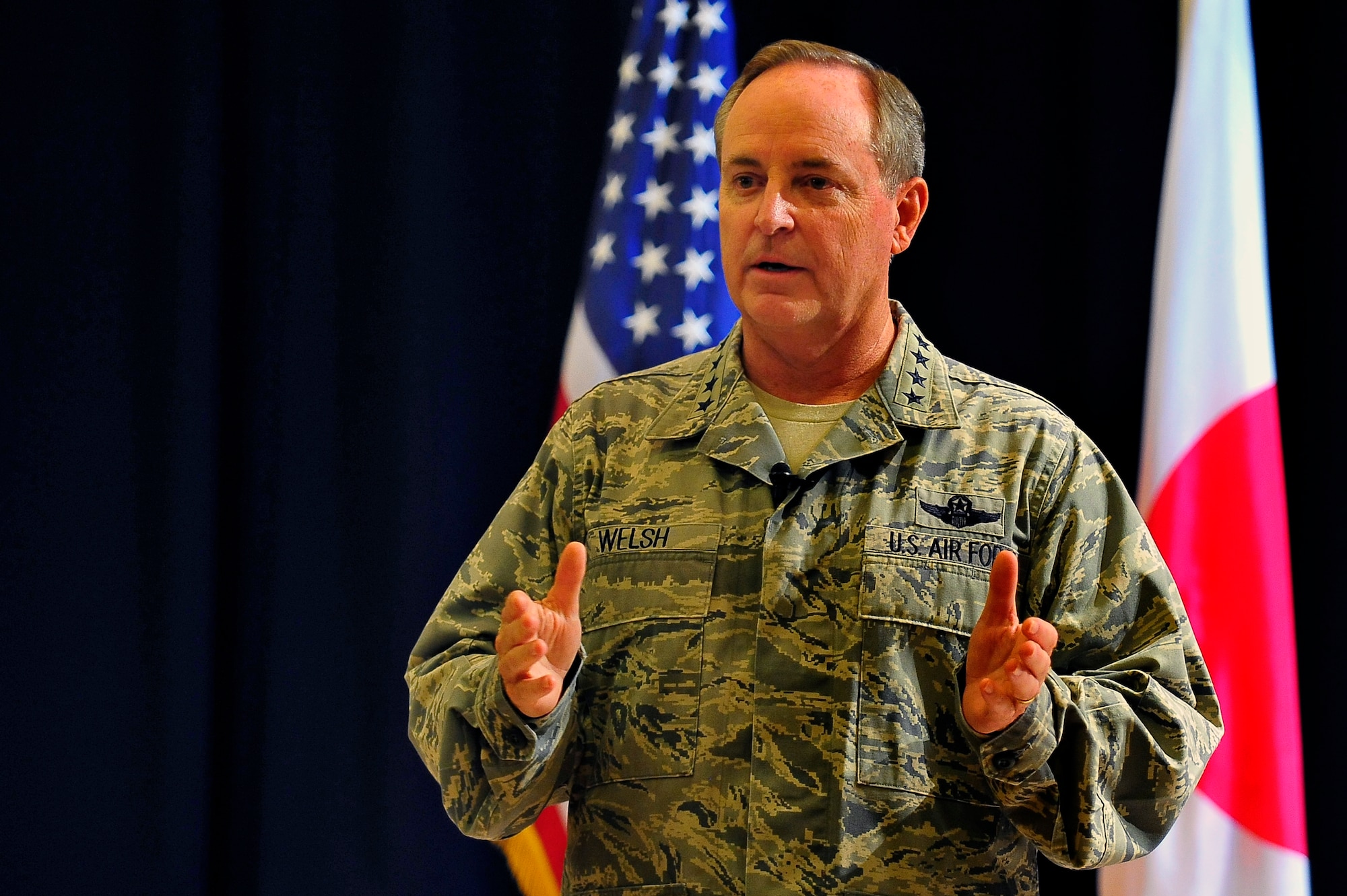 Air Force Chief of Staff Gen. Mark A. Welsh III addresses the audience during an Airman’s call at Misawa Air Base, Japan, Aug. 28, 2013. With a year under his belt as chief of staff, Welsh shared what he considers vial focus areas to ensure Air Force success moving forward -- common sense, communication and caring. (U.S. Air Force photo by Staff Sgt. Nathan Lipscomb)