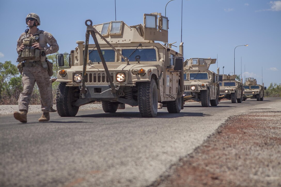 High-Mobility, Multi-Purpose Wheeled Vehicles with Weapons Co., Battalion Landing Team 2nd Battalion, 4th Marines, 31st Marine Expeditionary Unit, finish a 379 mile movement into the Australian outback here, Aug. 31. The convoy, led by Combat Logistics Battalion 31, 31st MEU, transported 189 troops in a line of 57 vehicles from Darwin to the training area for Exercise Koolendong 13. The exercise demonstrates the operational reach of the 31st MEU. Also participating in the exercise is the Marine Rotational Force – Darwin and soldiers of the 5th Royal Australian Regiment. The 31st MEU brings what it needs to sustain itself to accomplish the mission or to pave the way for follow-on forces. The 31st MEU is the Marine Corps' force in readiness for the Asia-Pacific region and the only continuously forward-deployed MEU. 