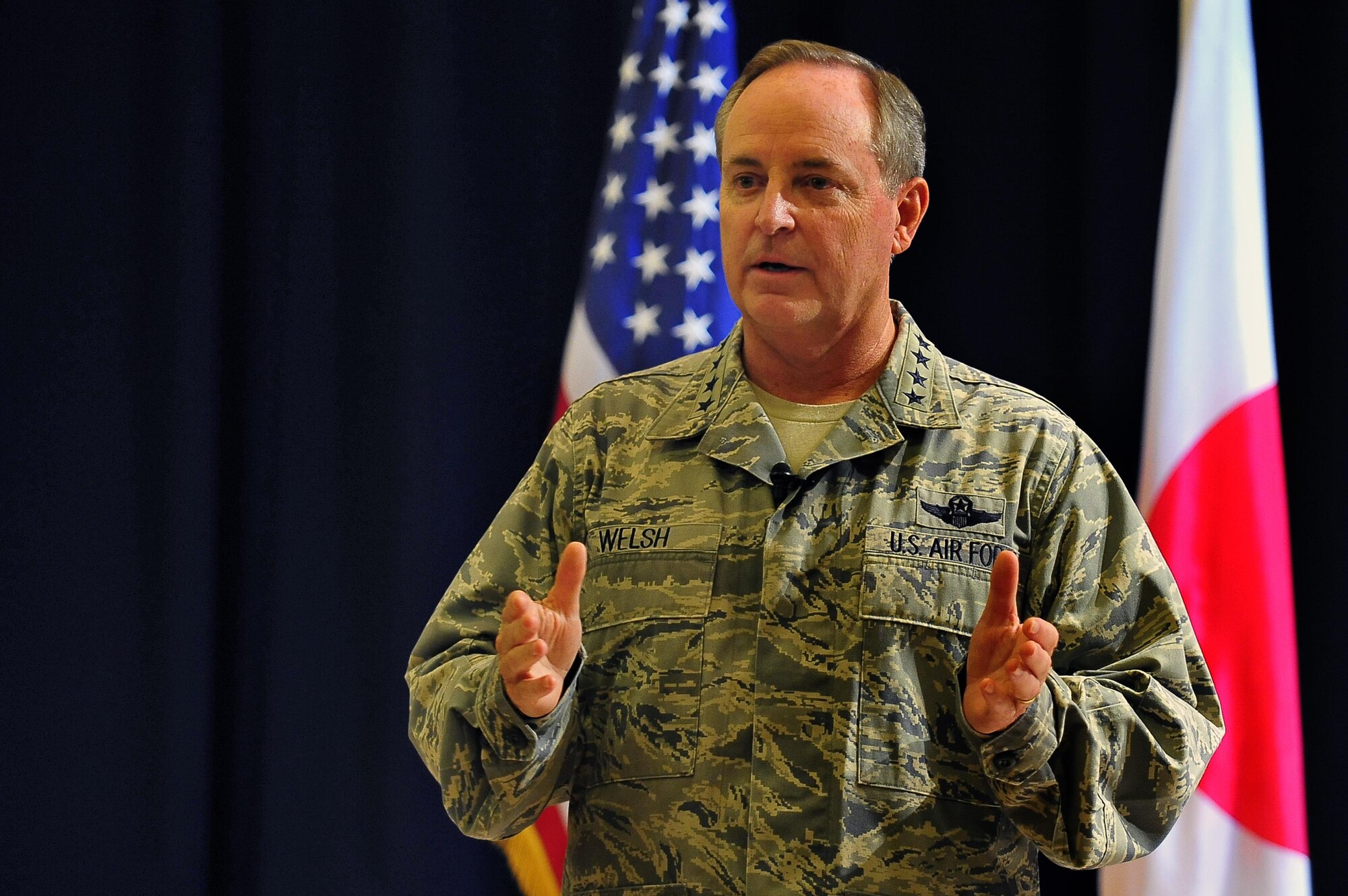 Air Force Chief of Staff Gen. Mark A. Welsh III addresses the audience during an Airman’s call Aug. 28, 2013, at Misawa Air Base, Japan. With a year under his belt as chief of staff, Welsh shared what he considers vial focus areas to ensure Air Force success moving forward -- common sense, communication and caring. (U.S. Air Force photo/Staff Sgt. Nathan Lipscomb)
