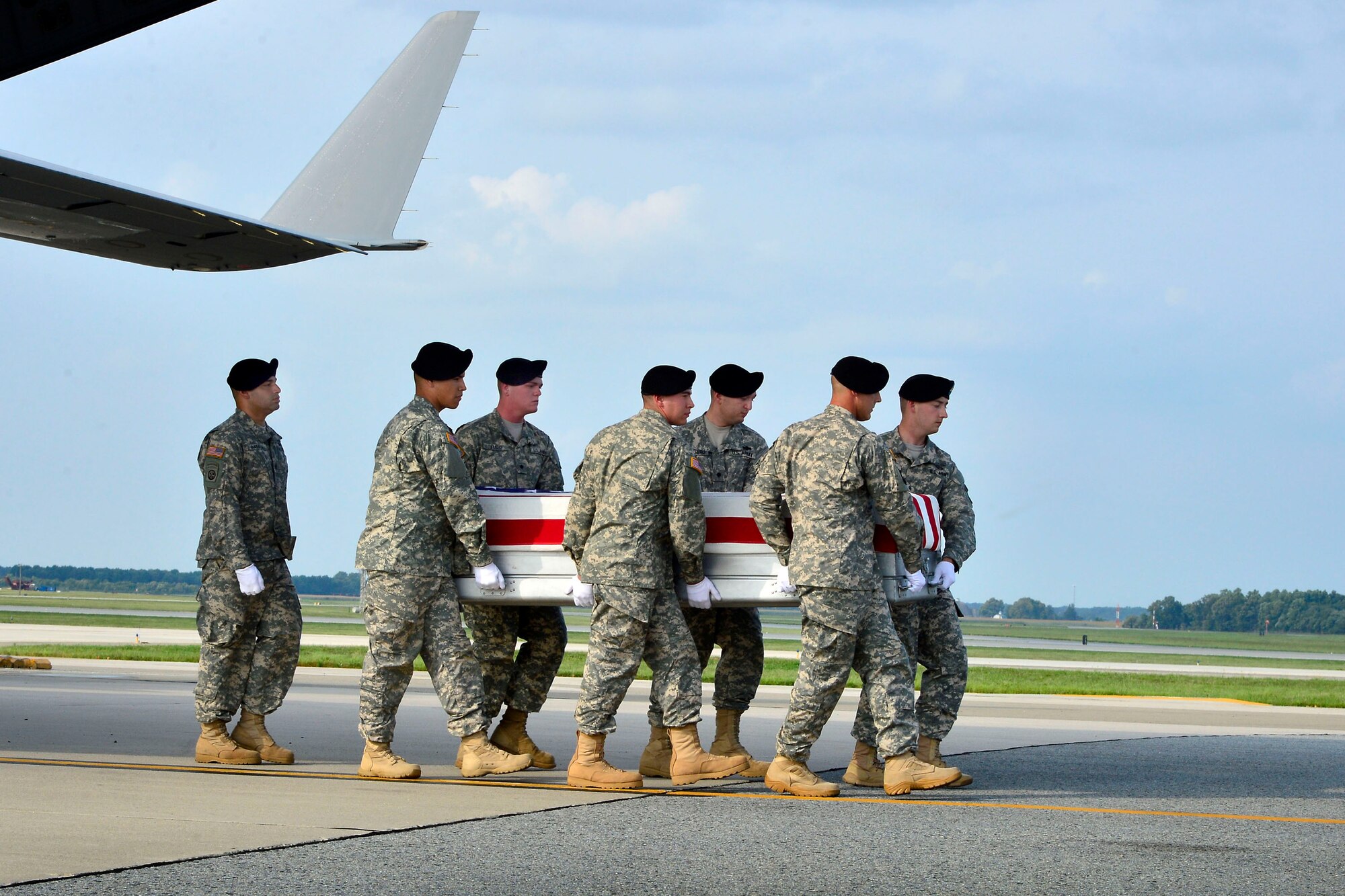 A U.S. Army carry team transfers the remains of Army Sgt. 1st Class Ricardo D. Young, of of Rosston, Ark.,  at Dover Air Force Base, Del., August 31, 2013. Young was assigned to the 307th Engineer Battalion (Combat/Airborne), 20th Engineer Brigade, XVIII Airborne Corps, Fort Bragg, N.C. (U.S. Air Force photo/David Tucker)