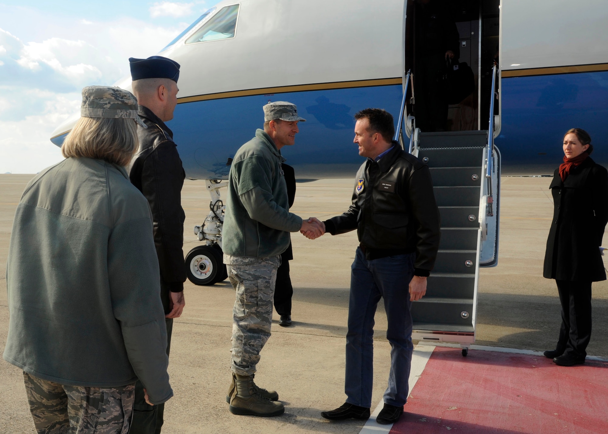 Wolf Pack leadership greets the Acting Secretary of the Air Force Eric K. Fanning, upon his arrival to Kunsan Air Base, Republic of Korea, Nov. 26, 2013. The secretary visited the Wolf Pack to get a better look at Kunsan’s mission of defending the base, accepting follow on forces and taking the fight North. (U.S. Air Force photo by Staff Sgt. Jessica Haas/Released)