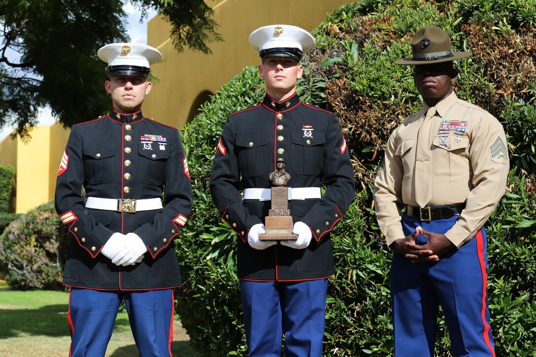 Pfc. Dominic V. Bernhard, honor graduate for Company I, and a Santa Rosa, Calif., native stands with his senior drill instructor (right) and recruiter Sgt. Jesus Ramirez (left) after graduation aboard Marine Corps Recruit Depot San Diego, Nov. 22. Bernhard was chosen as the company honor graduate because of his leadership skills, physical fitness and expert rifle score.