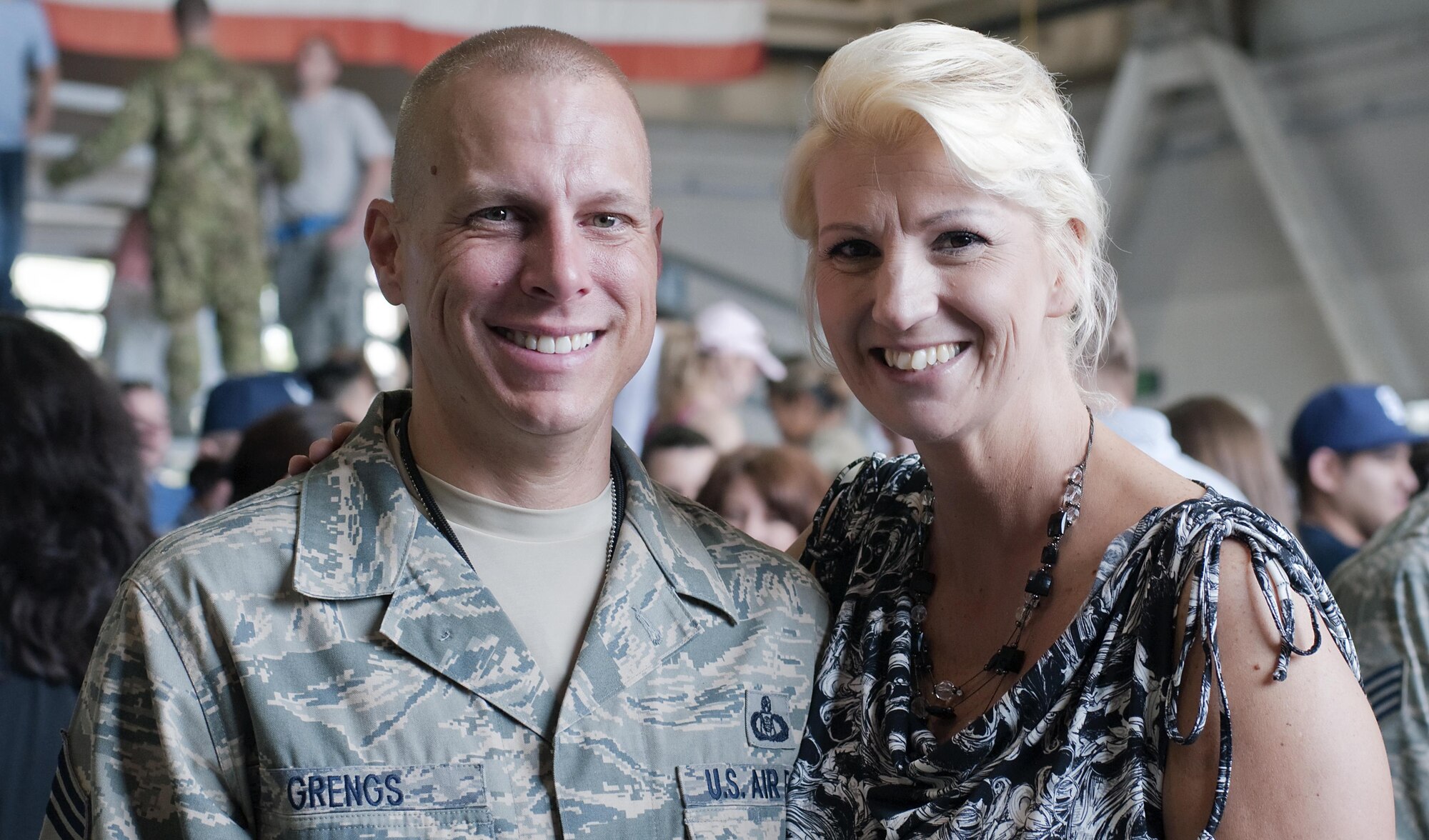 Chief Master Sgt. Matthew Grengs, 52nd Fighter Wing command chief is welcomed home from his deployment in 2012 by his wife, Estelle. Grengs served in the U.S. Air Force for 23 years and has received continued support throughout the years. (Courtesy photo/Chief Master Sgt. Matthew Grengs)