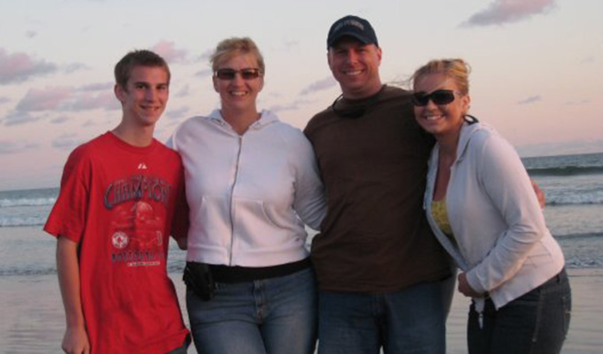 Chief Master Sgt. Matthew Grengs stands with his wife, Estelle (second from left), and his children. His son, Senior Airman Jacob Grengs, and his daughter, Korissa Pearson, wife of Staff Sgt. Christopher Pearson, have grown up in and around the U.S. Air Force. Grengs is the 52nd Fighter Wing command chief (Courtesy photo/Chief Master Sgt. Matthew Grengs)