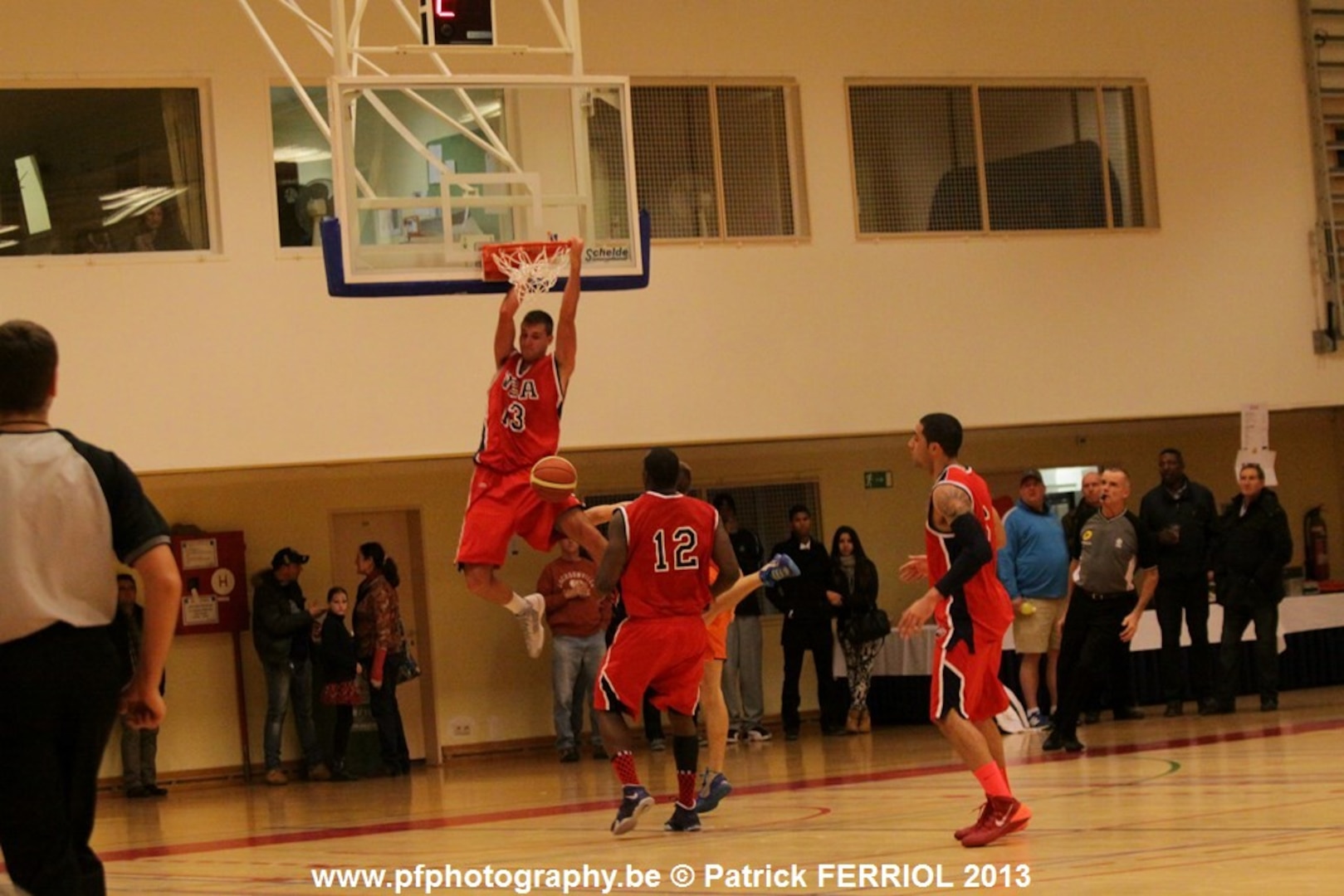 2d Lt Taylor Broekhuis slams the ball during the 2013 SHAPE International Basketball Tournament held at SHAPE (Mons), Belgium 24-30 November.  USA defeats Latvia 97-73 for the bronze medal.