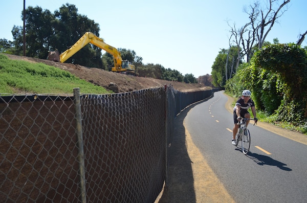 U.S. Army Corps of Engineers Sacramento District levee work is underway Aug. 21, 2013 along the north bank of the American River, just east of its confluence with the Natomas East Main Drainage Canal in north Sacramento, Calif. Complicating the project to install 3,300 linear feet of seepage wall in the levee are land easement rights, an inactive railroad line and an assortment of buried utilities that obstructed the Corps’ work near here more than a decade ago