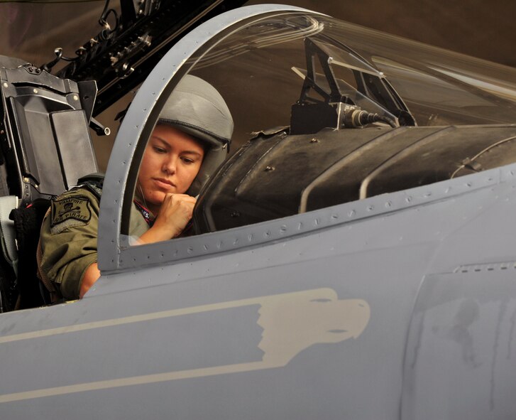 U.S. Air Force 1st Lt. Jillian Thompson, 44th Fighter Squadron F-15 Eagle pilot, makes some adjustments inside the cockpit before heading to Guam for Forager Fury II at Kadena Air Base, Japan, Nov. 26, 2013. Fourteen 44th FS F-15 Eagle pilots and approximately 120 maintainers will be deploying from the 44th Aircraft Maintenance Unit. (U.S. Air Force photo by Naoto Anazawa)