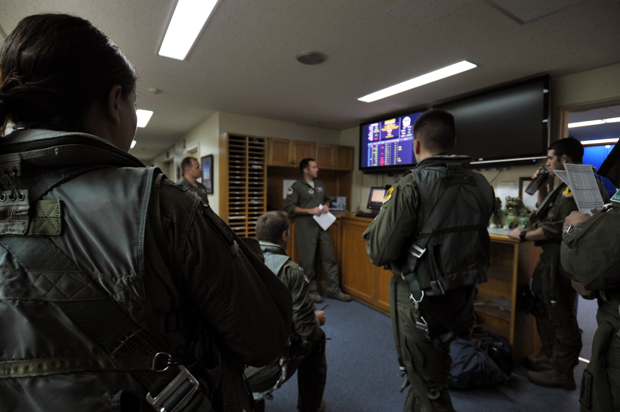 U.S. Air Force Maj. Brian Knauf, 44th Fighter Squadron assistant director of operations, briefs Kadena F-15 Eagle pilots before heading to Guam for Forager Fury II at Kadena Air Base, Japan, Nov. 26, 2013. More than 280 Airmen from the 18th Wing deployed to Guam to join Marine-led Forager Fury II exercise for three weeks. (U.S. Air Force photo by Naoto Anazawa)