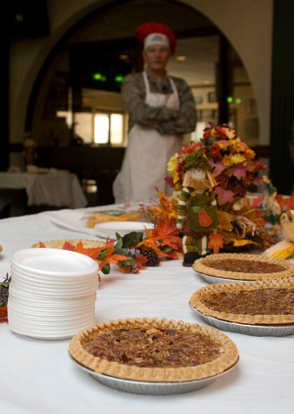 U.S. Air Force Lt. Col. Lance French, 7th Mission Support Group deputy commander, stands by the dessert table during Team Dyess’ annual Thanksgiving Day dinner, Nov. 28, 2013, at Dyess Air Force Base, Texas. The meal, which was hosted at the Hangar Center Commons, was open to the entire military community including their families and retirees. (U.S. Air Force photo by Senior Airman Peter Thompson/Released)