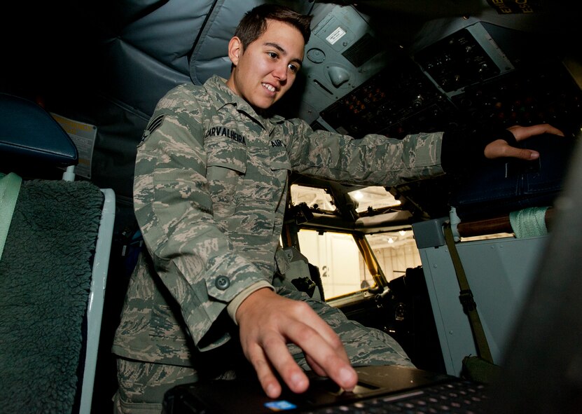Senior Airman Cassandra Carvalheira, 22nd Aircraft Maintenance Squadron communications and navigations journeyman, goes through a checklist onboard a KC-135 Stratotanker Nov.21, 2013, at McConnell Air Force Base, Kan. Carvalheira was selected to be the 22nd Air Refueling Wing spotlight performer for the week of Nov. 25 through 29. (U.S. Air Force photo/Airman 1st Class Victor J. Caputo)