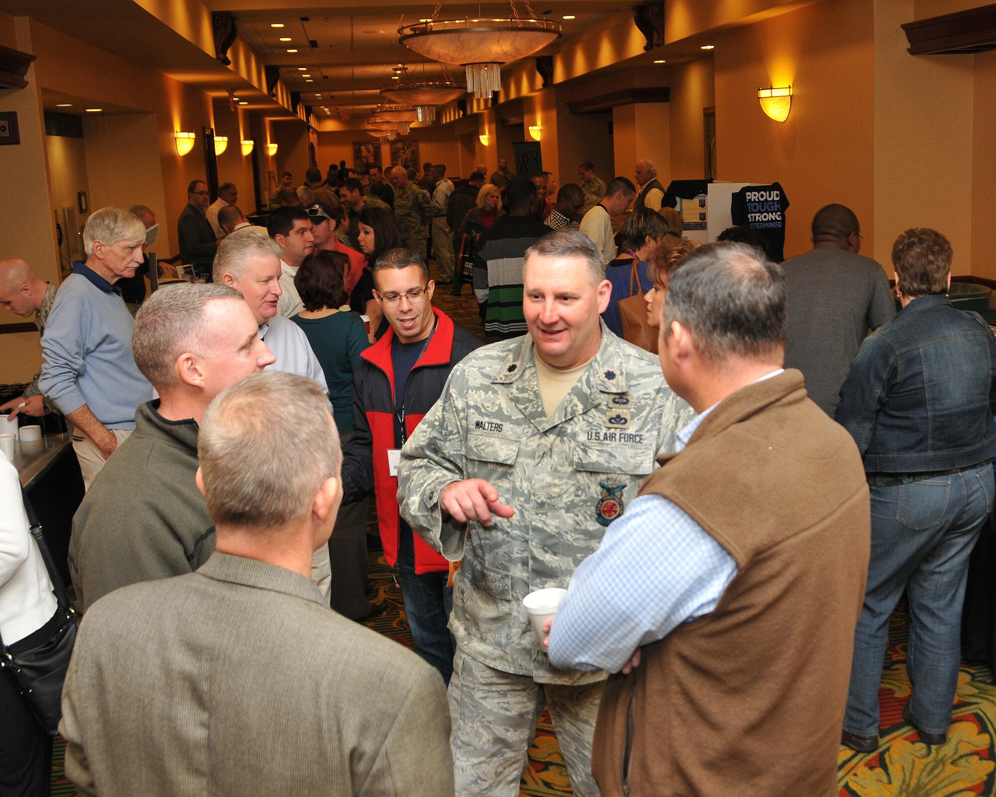 U.S. Air Force Lt. Col. Greg Walters, commander, 145th Civil Engineer Squadron, North Carolina Air National Guard, talks with his troops during the first ever North and South Carolina ANG joint Yellow Ribbon Reintegration Program event.  The YR Program serves as a series of stepping stones to help reunite families and reacclimatize Airmen and Soldiers to the civilian world.  Several members from 145th CES who recently returned from a six month deployment attended the YR event which was held in Charlotte, N.C., November 16, 2013. (Air National Guard photo by Master Sgt. Patricia F. Moran/Released)