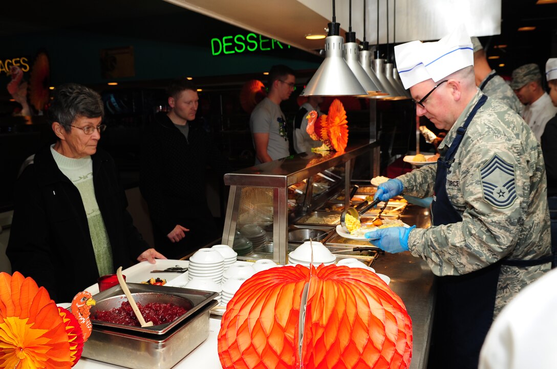 Langley Air Force Base leaders prepare plates during the Thanksgiving meal at the Crossbow Dining Facility at Langley Air Force Base, Va., Nov. 28, 2013. To help Service members who may not have been able to go home for the holiday, Joint Base Langley-Eustis personnel served meals at dining facilities at Langley and Fort Eustis, Va. (U.S. Air Force photo by Airman Areca T. Wilson/Released)