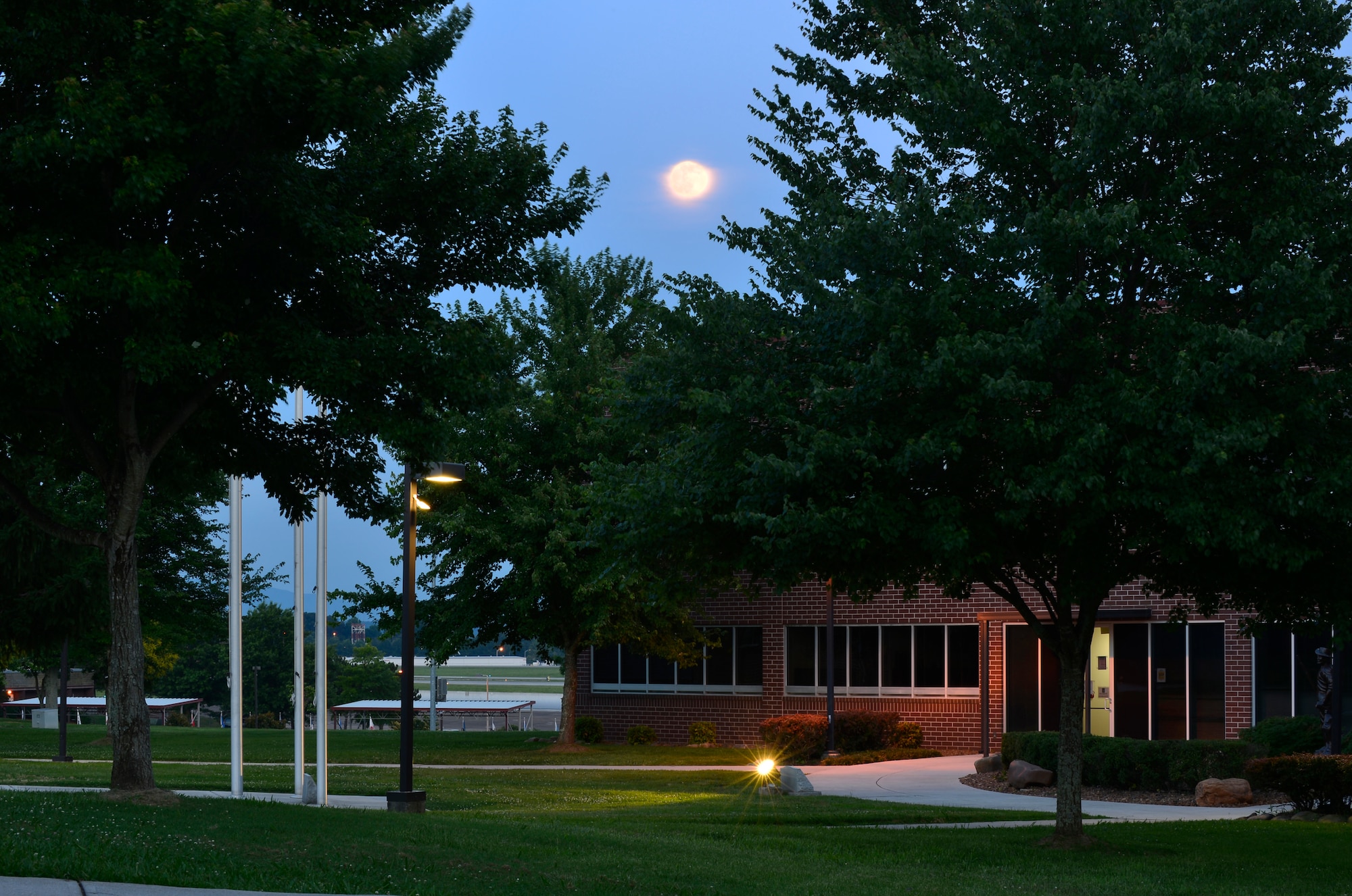 MCGHEE TYSON AIR NATIONAL GUARD BASE, Tenn. - The full moon rises above the tree tops on a still night at the I.G. Brown Training and Education Center's campus, June 22, 2013, outside the Smoky Mountains. Since 1968, men and women have brought the campus to life. (U.S. Air National Guard photo by Master Sgt. Kurt Skoglund/Released)