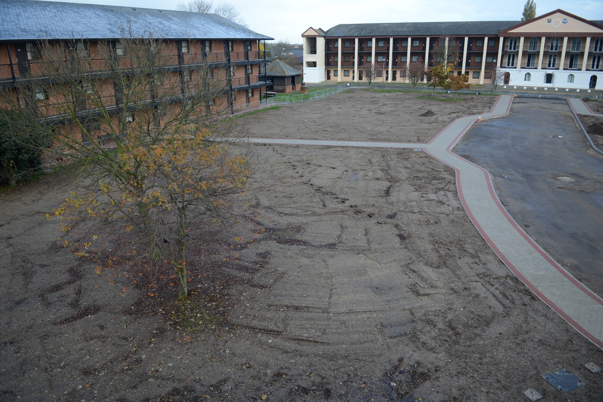A former parking lot on RAF Mildenhall is prepared for grass to be laid Nov. 25, 2013, after a removal of the concrete surface. The new area will include a grassy field for Airmen to use as they see fit. (U.S. Air Force photo by Airman 1st Class Dillon Johnston/Released)