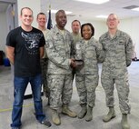 Members of the 916th Operations Group proudly hold the Lt. Gen. James E. Sherrard III award. Col. Caroline Evernham, commander of the 916th Operations Group, accepted the award at the 2013 Airlift/Tanker Association Conference in Orlando, Fla., Nov. 2. (USAF courtesy photo)