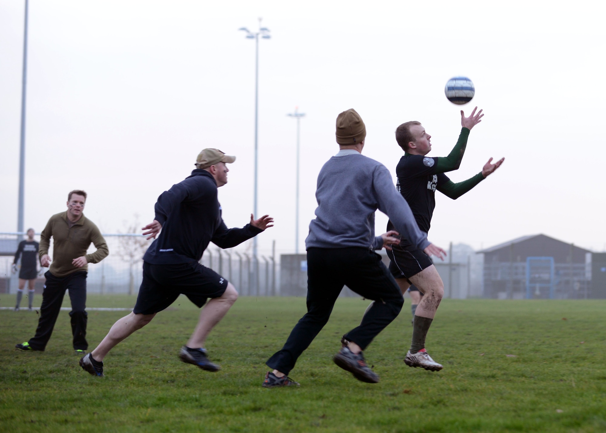 Members of the 352nd Special Operations Group play gatorball during the 352nd SOG Olympics Nov. 27, 2013, on RAF Mildenhall, England. Gatorball combines aspects of both soccer and rugby. Other events included a basketball tournament, push-up contest and ruck march. (U.S. Air Force photo by Airman 1st Class Preston Webb/Released)