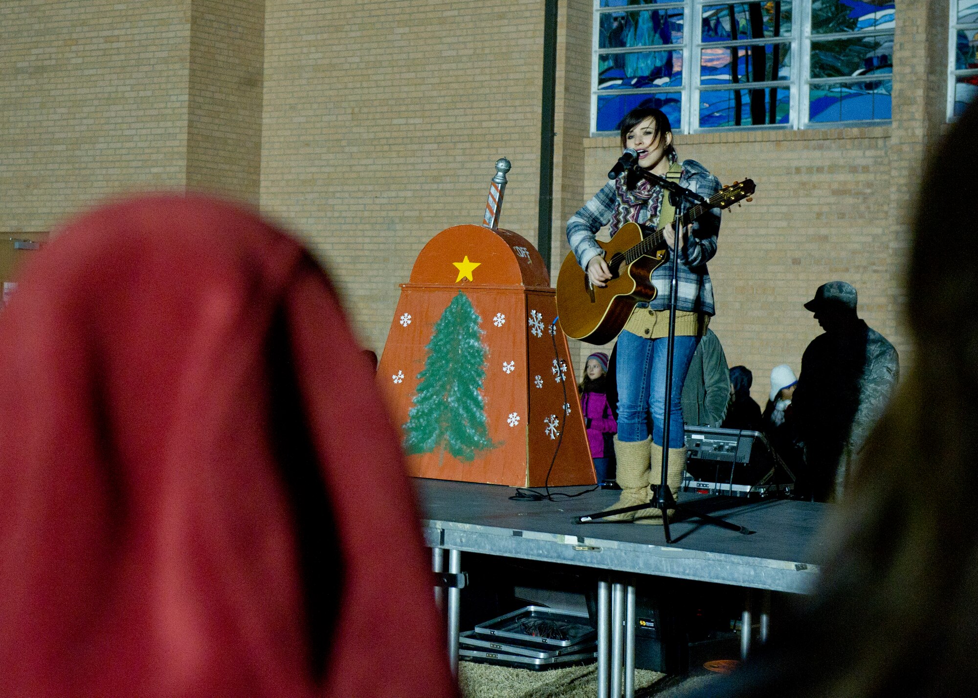 Savannah Berry, a former contestant on The Voice, performs at the annual Christmas tree and Menorah lighting ceremony at Holloman Air Force Base N.M., Nov. 22. Berry also performed at the 49th Wing holiday party later that evening.(U.S. Air Force photo by Airman 1st Class Chase Cannon/Released)