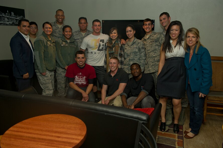 Savannah Berry, a former contestant on The Voice, poses with Airmen at the Refuel Café before preforming at the annual Christmas tree and menorah lighting ceremony at Holloman Air Force Base N.M., Nov. 22. Berry also performed at the 49th Wing holiday party later that evening.(U.S. Air Force photo by Airman 1st Class Chase Cannon/Released)