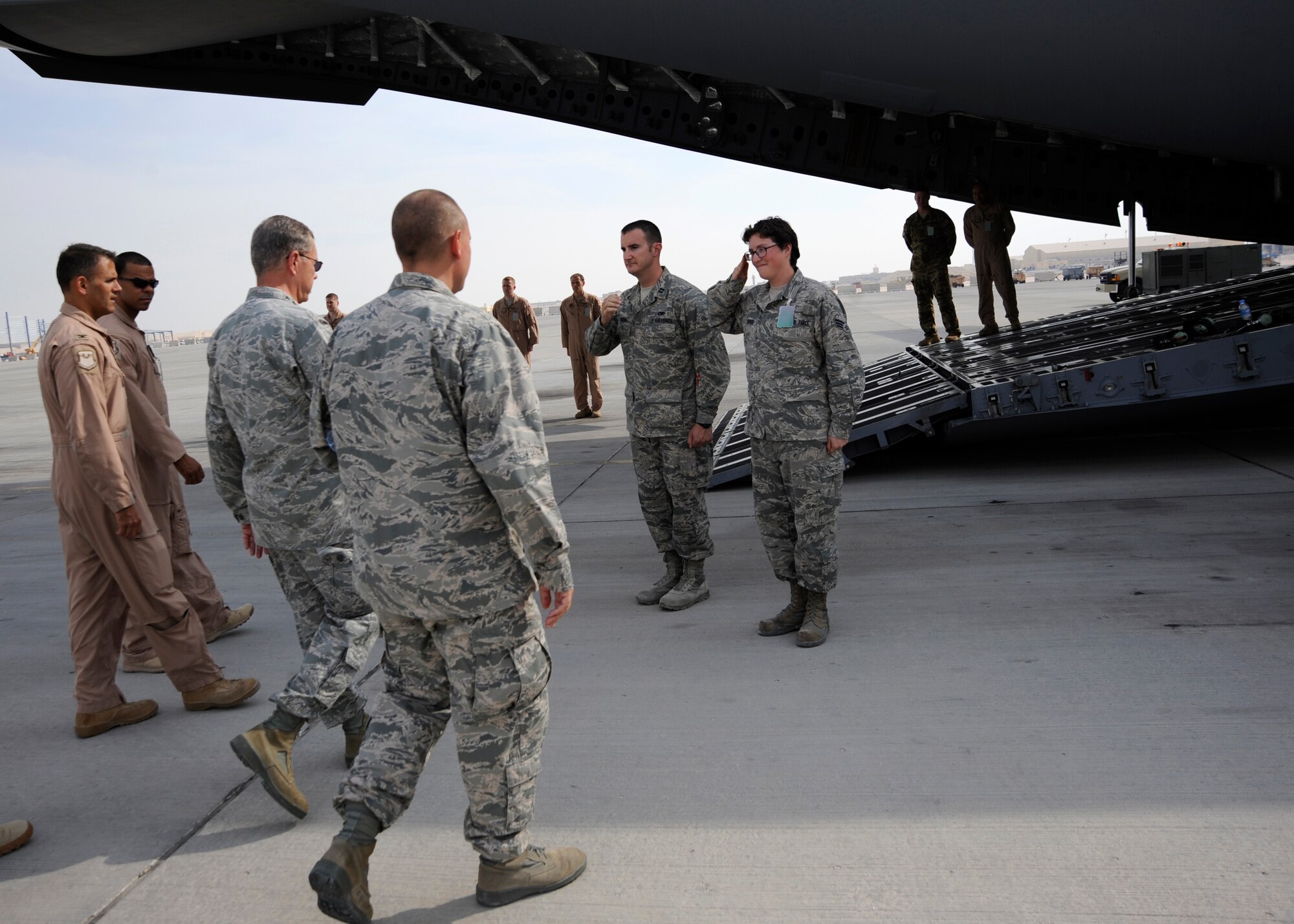 Airmen assigned to the 8th Expeditionary Air Mobility Squadron greet Gen. William M. Fraser III during his visit to the 379th Air Expeditionary Wing in Southwest Asia, Nov. 28, 2013. The general’s visit was to share the Thanksgiving holiday with deployed troops and thank them for their service and sacrifice. Fraser is the commander of U.S. Transportation Command. (U.S. Air Force photo/Senior Airman Bahja J. Jones) 