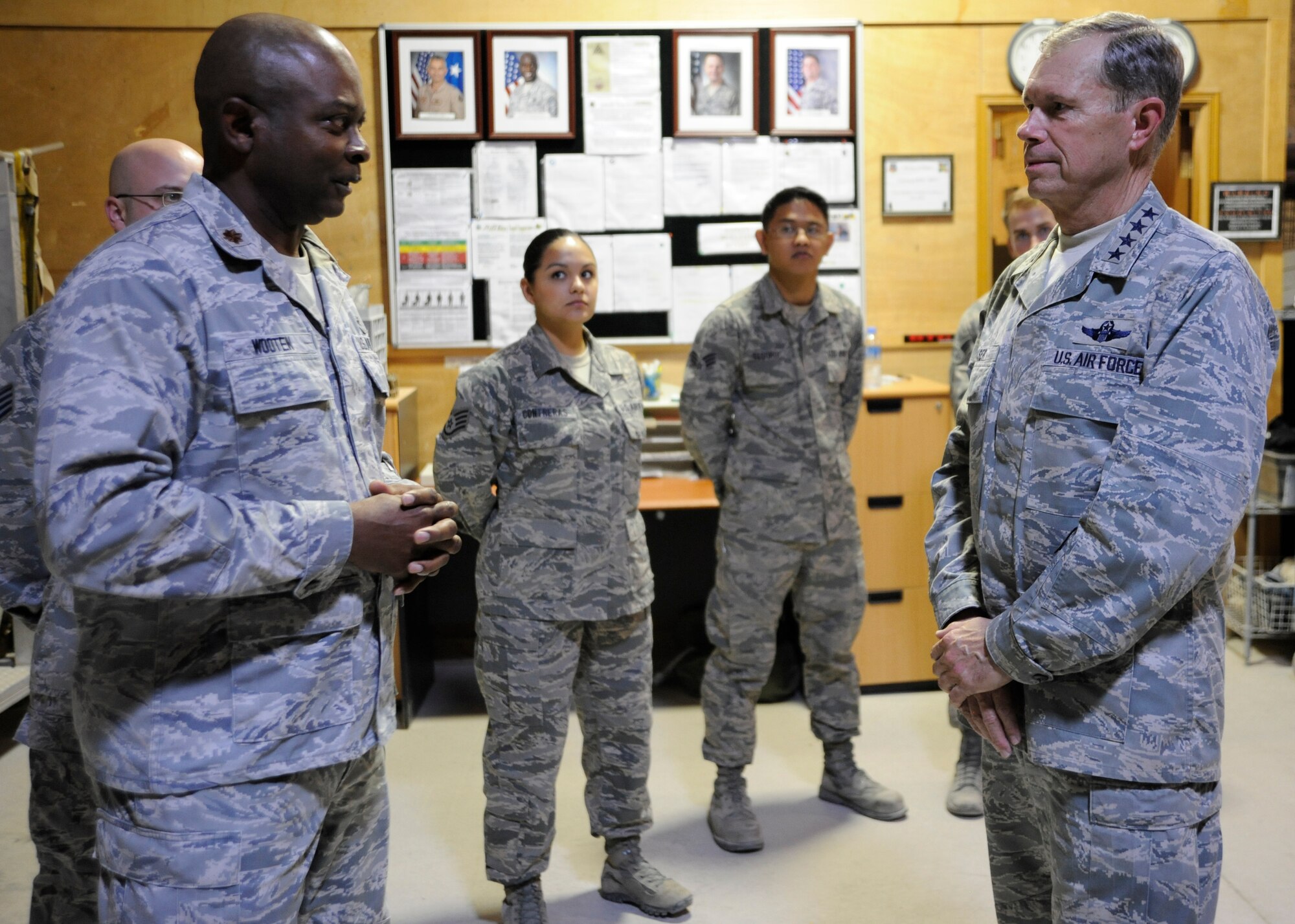 Maj. Dennis Wooten gives Gen. William M. Fraser III a mission brief about the Blood Transshipment Center at the 379th Air Expeditionary Wing in Southwest, Nov. 29, 2013. The general’s visit was to share the Thanksgiving holiday with deployed troops and thank them for their service and sacrifice. Wooten is the 379th Expeditionary Medical Support Squadron BTC flight commander deployed from Wright-Patterson Air Force Base, Ohio. Fraser is the commander of U.S. Transportation Command. (U.S. Air Force photo/Senior Airman Bahja J. Jones)

 
