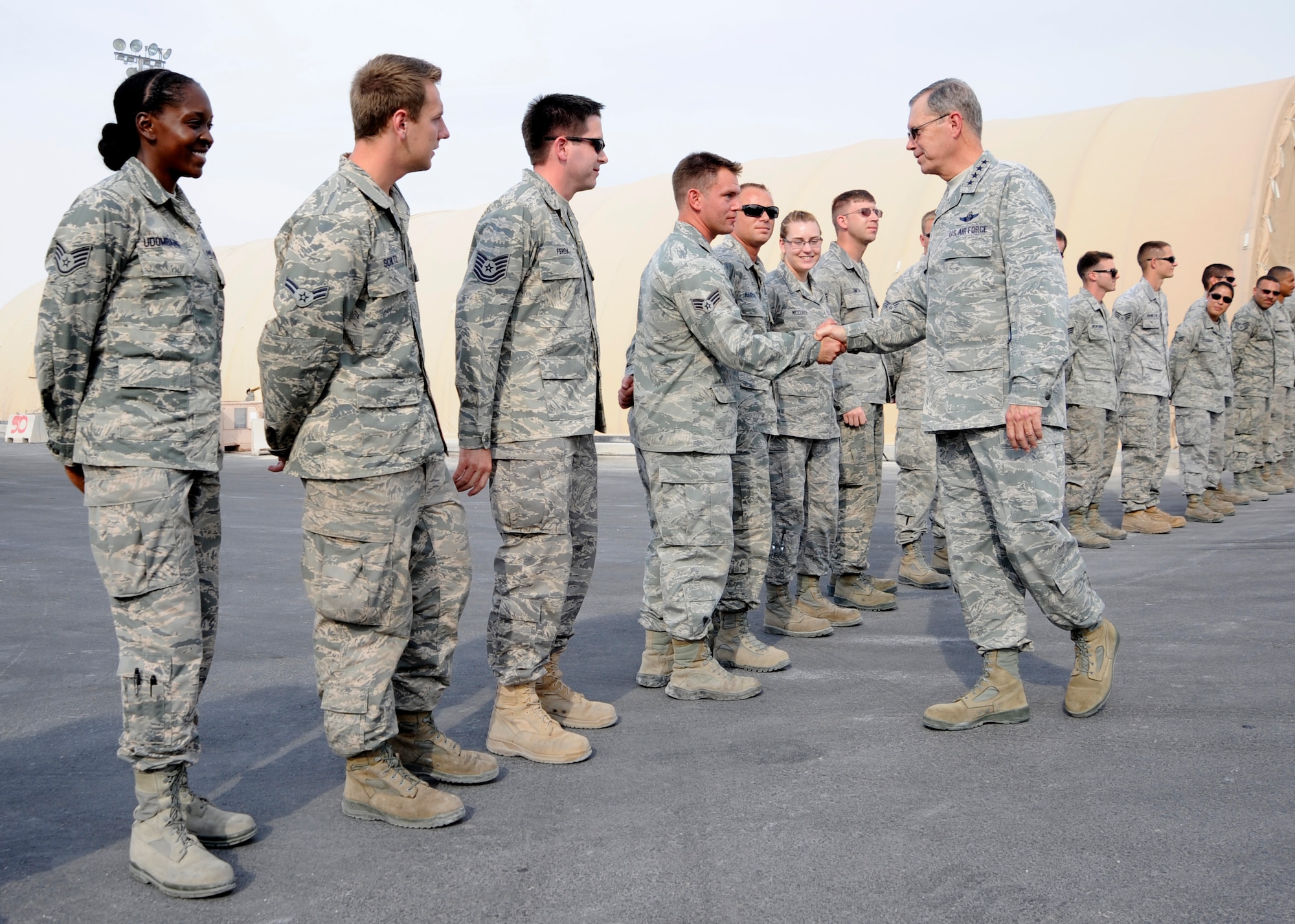 Gen. William M. Fraser III greets Airmen assigned to the 8th Expeditionary Air Mobility Squadron during a visit to the 379th Air Expeditionary Wing in Southwest Asia, Nov. 29, 2013. The general’s visit was to share the Thanksgiving holiday with deployed troops and thank them for their service and sacrifice. Fraser is the commander of U.S. Transportation Command. (U.S. Air Force photo/Senior Airman Bahja J. Jones)



