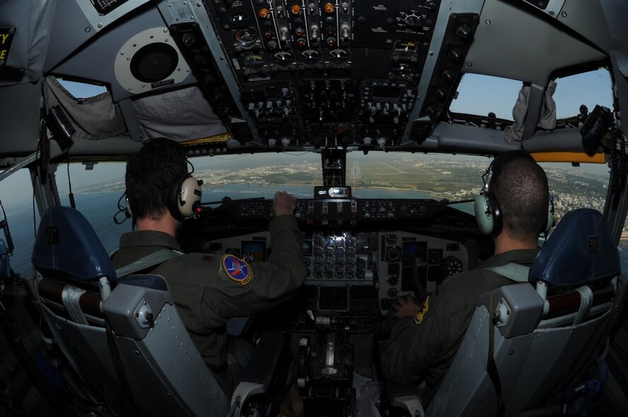 U.S. Air Force Maj. Mark Clark, 909th Air Refueling Squadron chief of current operations (left), and 1st Lt. Aaron Arntz, 909th ARS training officer (right), make their final approach to land a KC-135 Stratotanker on the flightline of Kadena Air Base, Japan, Nov. 26, 2013. The 18th Wing regularly conducts flight training to ensure pilots remain proficient and mission ready for the common defense of Japan and the Asia-Pacific region. (U.S. Air Force photo by Airman 1st Class Keith James)