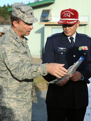 U.S. Air Force Col. Danny “Chip” Johnson, 35th Mission Support Group commander, visits with the Japan Air Self Defense Force Lt. Col. Kazuaki Kamada, chief of Misawa’s Air Base Support Group, during a tour of the latter’s support group facilities Nov. 20, 2013, at Misawa Air Base, Japan. Commanders within the 35 MSG visited their counterparts in five JASDF agencies in an effort to expand relationships between the two forces. These visits are held twice a year, in an effort to further develop cross cultural competencies. (U.S. Air Force photo/Staff Sgt. Alyssa C. Wallace)