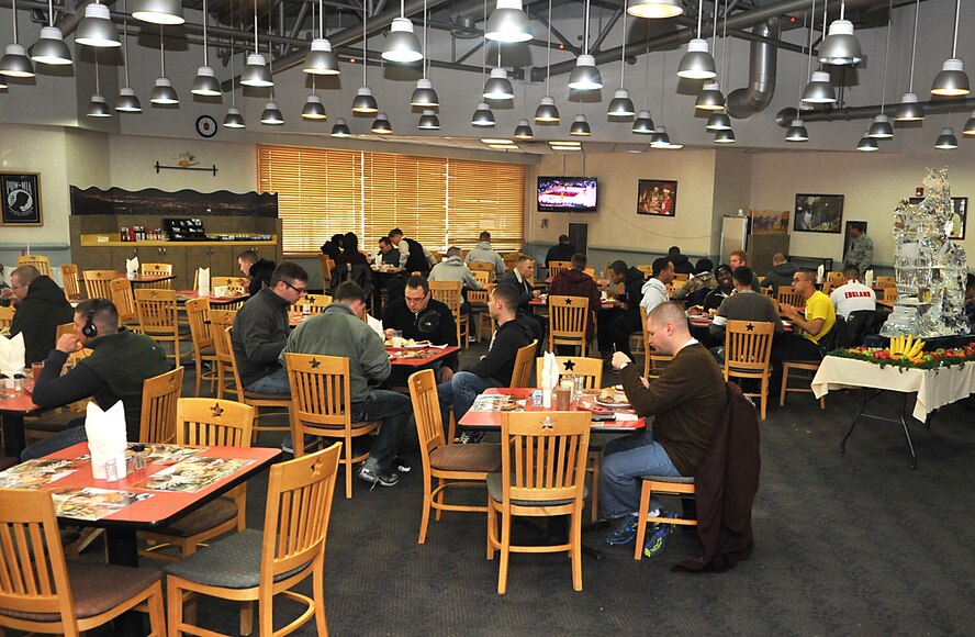 Airmen and Soldiers enjoy their Thanksgiving lunch in the Ginkgo Tree dining facility at Osan Air Base, Republic of Korea, Nov. 28, 2013. Approximately 390 Airmen, Soldiers and other patrons dined at the Ginkgo Tree to savor the holiday selections and enjoy the festive decor. (U.S. Air Force photo/Airman 1st Class Ashley J. Thum)