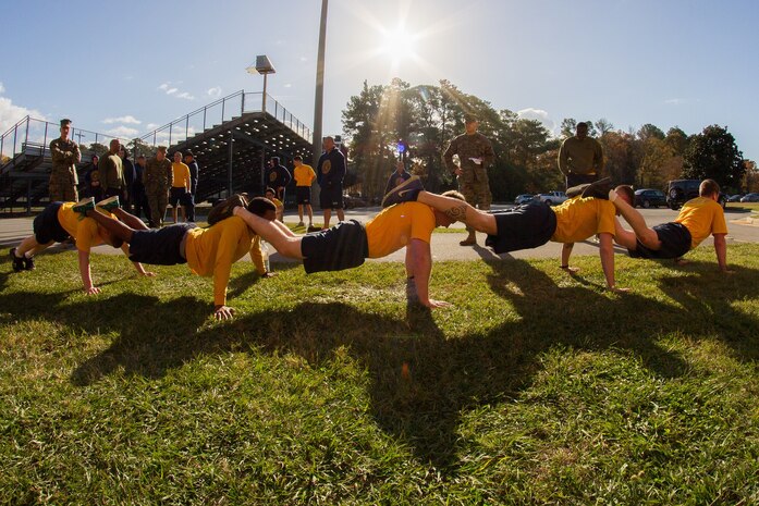 Corpsmen from 6th Marine Regiment, 2nd Marine Division competing in a timed team event during the Annual "One Team One Fight" held at Gottege Field House