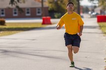 A Corpsman from 6th Marine Regiment, 2nd Marine Division returning from a continuous non-stop timed Physical Readiness Test during the Spartan event