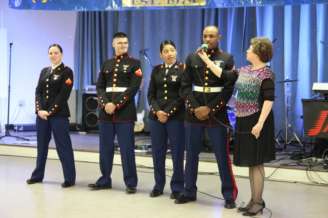 Marines stationed at Cherry Point introduce themselves as volunteers for a Toys for Tots event hosted by the New Bern Singles Club Nov. 16 at the Knights of Columbus facility. During the event the Marines helped collect toys and raise awareness about the program. 

