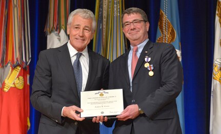 Secretary of Defense Chuck Hagel awards outgoing Deputy Secretary of Defense Ashton B. Carter after awarding him the Department of Defense Medal for Distinguished Public Service during a farewell ceremony in the Pentagon Auditorium Dec. 2, 2013. DoD photo by Glenn Fawcett (Released)
