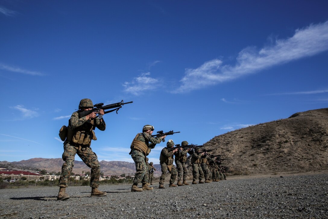 Marines with the 15th Marine Expeditionary Unit fire at targets during a small-arms training exercise at Range 111 aboard Camp Pendleton, Calif., Nov. 25. The training focused on enhancing the unit’s confidence and proficiency with personal weapons and M67 Fragmentation Hand Grenades. (U.S. Marine Corps photo by Cpl. Emmanuel Ramos)
