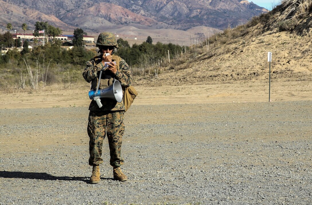 Corporal Richard Hernandez, data network specialist, 15th Marine Expeditionary Unit, calls firing commands during a small-arms training exercise at Range 111 aboard Camp Pendleton, Calif., Nov. 25. The training focused on enhancing the unit’s confidence and proficiency with personal weapons and M67 Fragmentation Hand Grenades. Hernandez, 22, is from Temecula, Calif. (U.S. Marine Corps photo by Cpl. Emmanuel Ramos)