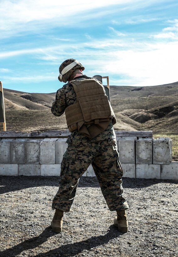 Sergeant Justin Maggard, logistics management coordinator, 15th Marine Expeditionary Unit, engages a target with his M4A1 during a small-arms training exercise at Range 111 aboard Camp Pendleton, Calif., Nov. 25. The training focused on enhancing the unit’s confidence and proficiency with personal weapons and M67 Fragmentation Hand Grenades. (U.S. Marine Corps photo by Cpl. Emmanuel Ramos)