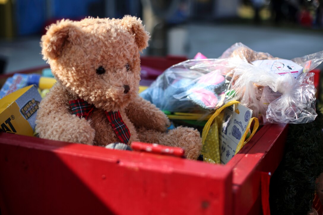Toys overflow the bins at the Marine Thrift Store after motorcyclists and participants made their donations at the Motorcycle Rally and Toy Drive aboard Marine Corps Air Station Iwakuni, Japan, Nov. 24, 2013. The main goal of the event was to collect 100 toys, but with participants help approximately 250 toys were accumulated. 