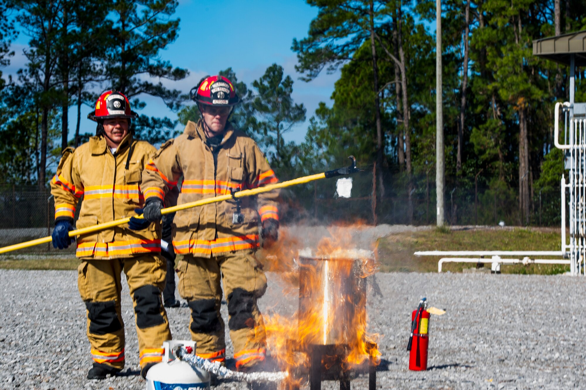 Firefighters from the 1st Special Operations Civil Engineer Squadron observe a fire break out during a safety demonstration at the fire training area on Hurlburt Field, Fla., Nov. 27, 2013. Placing a frozen or wet turkey into a fryer can result in a fire mishap. (U.S. Air Force photo/Senior Airman Christopher Callaway)