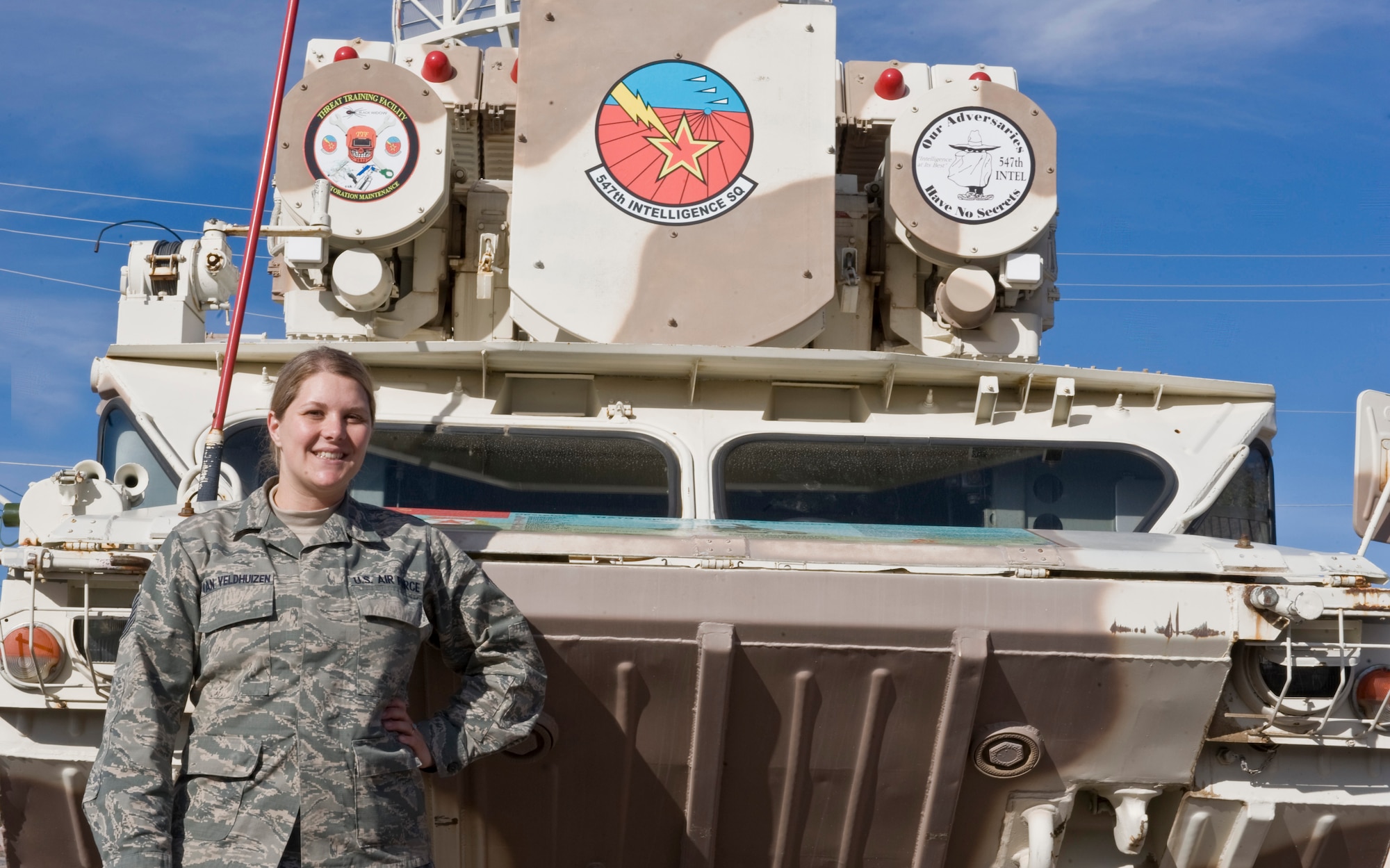 U.S. Air Force Tech. Sgt. Stephanie Van Veldhuizen, 547th Intelligence Squadron Central Command Integrated Air Defense Systems NCO in charge, stands by a SA-8 GECKO low altitude surface-to-air missile system Nov. 26, 2013, at Nellis Air Force Base, Nev. Van Veldhuizen was selected as the Nellis Top III MVP award winner for the month of October. During the month of September, 2013, she dedicated 72 hours to the successful completion of her Iranian Integrated Air Defense certification culminating in a one hour briefing in which she passed vital tactical adversary intelligence to the 53rd Aggressors. Also during this time Van Veldhuizen filled a Master Sgt. Flight Chief position for 10 days and led 44 DOD members through 13 production requirements. Additionally, she devoted her personal time to provide security for 25,000 people at the Barrett Jackson Fundraiser, which raised $500,000 towards the Wounded Warriors Project. Van Veldhuizen led seven off-duty Airmen during 64 hours of community service, raising $528 for the 547th Intelligence Squadron Unit Advisory Council. As a leader in the community, she served 850 children and 75 staff members breakfast with Chefs for Kids and also worked with Three Square to inspect, sort and package eight pallets of dry goods and produce for distribution throughout Las Vegas. Lastly, she volunteered as project coordinator for the 57th Wing National Disability Employment Awareness Month, where she lead three meetings, coordinated with four community organizations and secured the donations of $500 of goods for the upcoming Awareness 5-kilmoeter run. (U.S. Air Force photo by Senior Airman Matthew Lancaster)