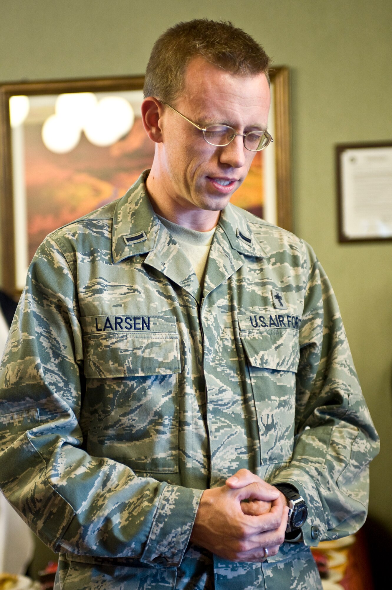 U.S. Air Force Chaplain (1st Lt.) Ammon Larsen, 99th Air Base Wing, leads the invocation before the Thanksgiving meal at the Crosswinds Dining Facility Nov. 28, 2013, at Nellis Air Force Base, Nev. Chaplain Larsen provides a prayer to give thanks for the meal. (U.S. Air Force photo by Senior Airman Matthew Lancaster)