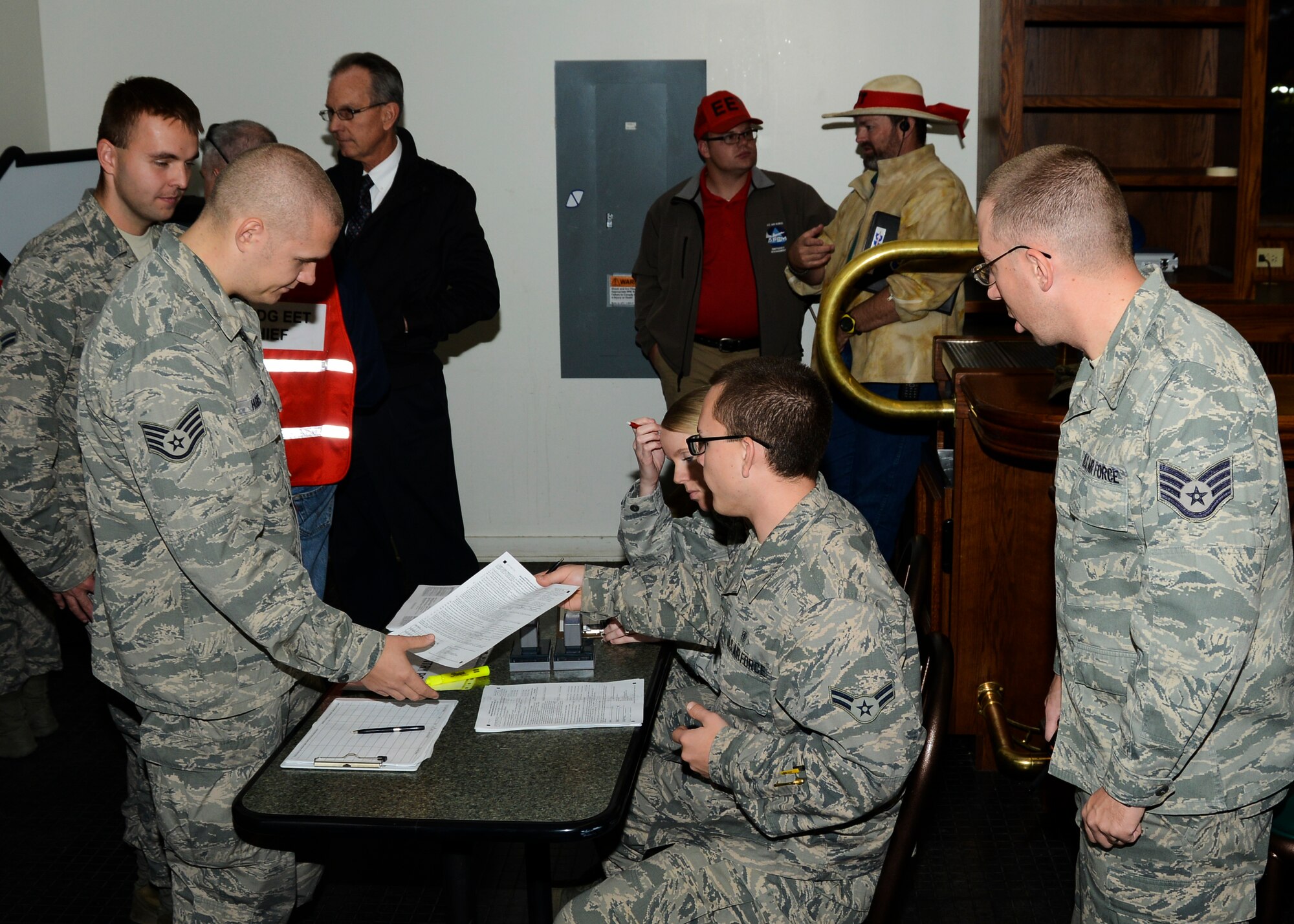 During the exercise, members of the Emergency Operations Center reported to the POD for their vaccinations. The initial checkpoint determined whether a patient needed a vaccination or isolation. (U.S. Air Force photo by Rebecca Amber)