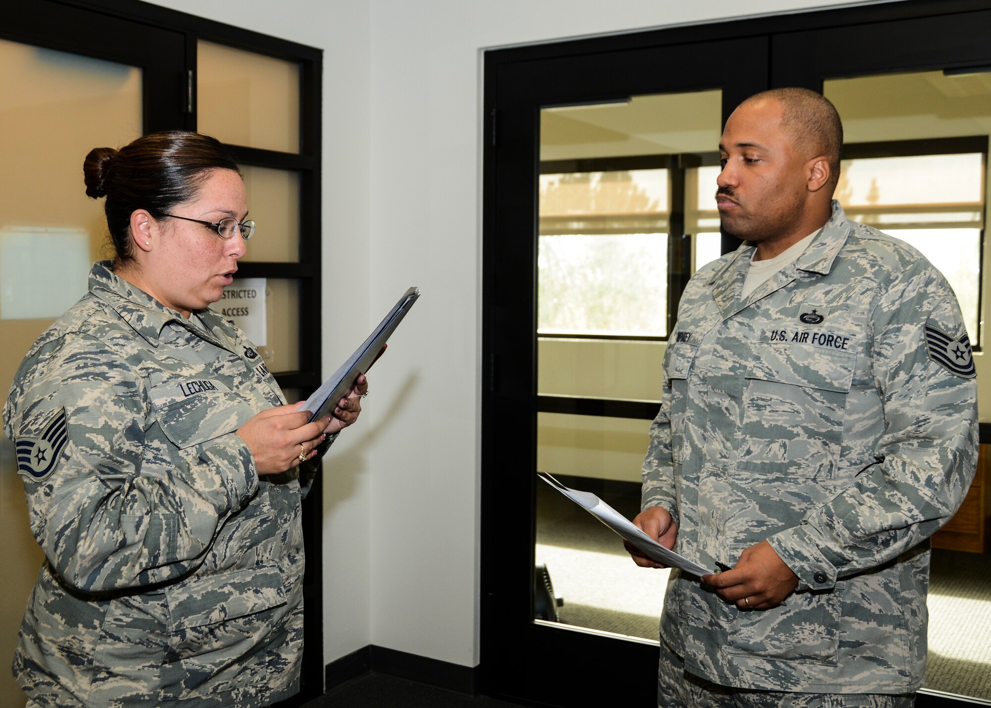 Members of the Casualty Augmentation Support Team in Bldg. 3000 practice their official notification process for the smallpox outbreak exercise Dec. 2. (U.S. Air Force photo by Rebecca Amber)