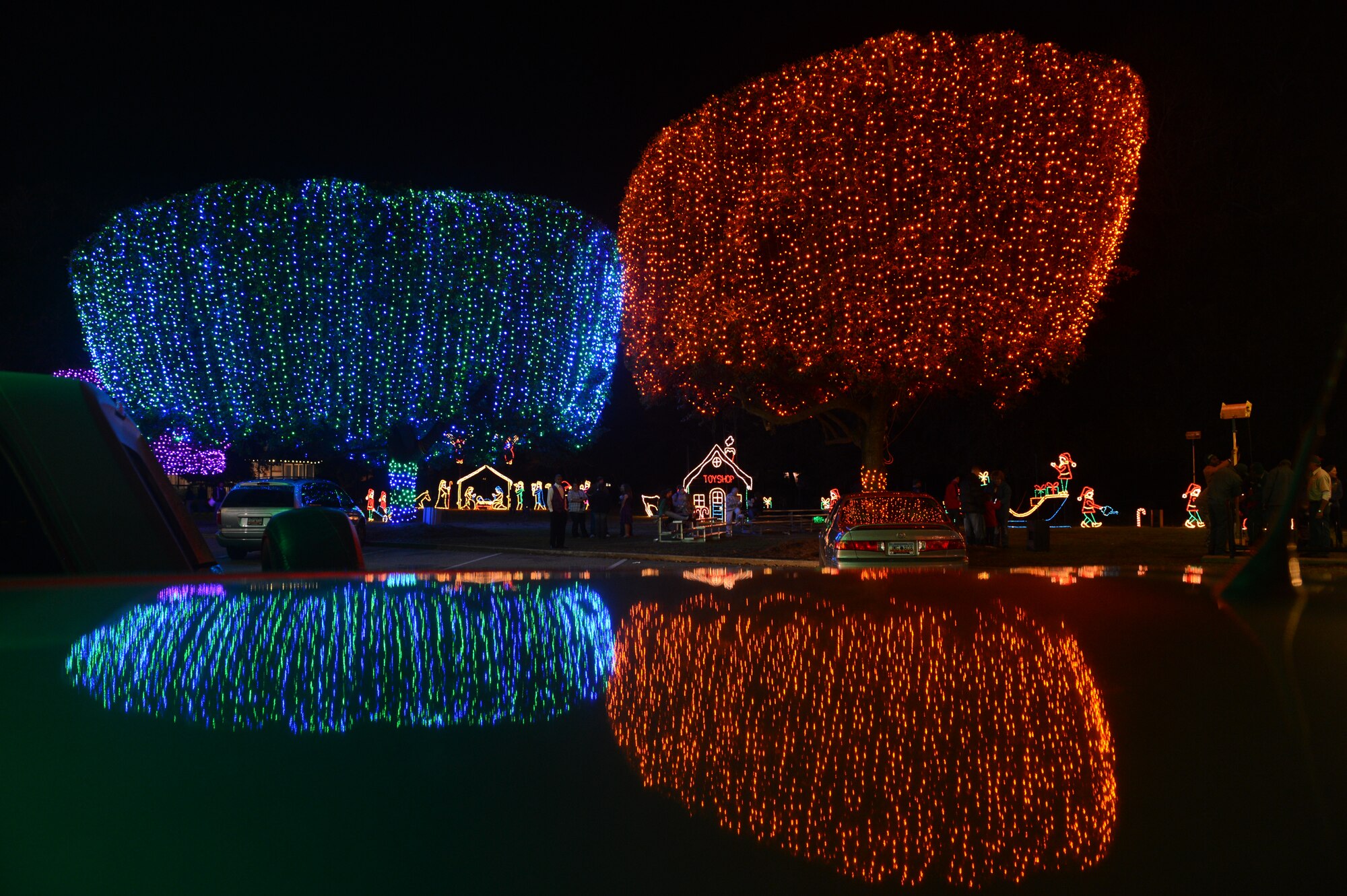 Light from the Fantasy of Lights event glows in all directions at Swan Lake Iris Gardens, Sumter, S.C., Dec. 1, 2013. Over one million lights made this event one of the largest Christmas light displays in the state. (U.S. Air Force photo by Tech. Sgt. Frank Miller/Released)