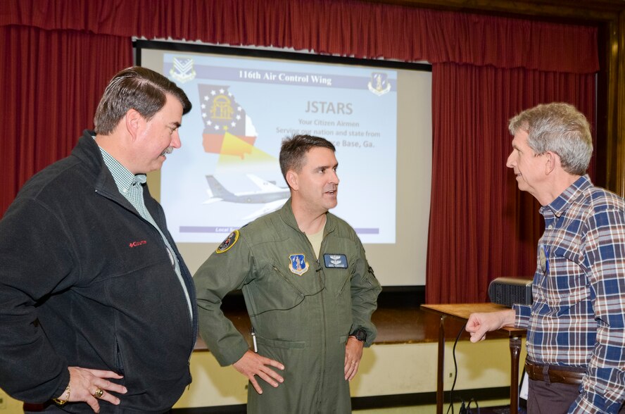 U.S Air Force Lt. Col. John Verhage, 116th Operations Group deputy commander, Georgia Air National Guard, talks with members of the Warner Robins Rotary Club, Warner Robins, Ga., Dec. 3, 2013. Verhage and members of the 116th ACW Public Affairs office visited the Rotary Club during the Georgia National Guard Podium Week to share about the mission and successes of the Joint STARS 116th ACW and the Georgia National Guard. (U.S. Air National Guard photo by Tech. Sgt. Regina Young/Released)